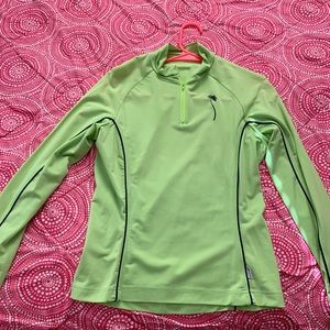 A workout light green sweater .